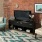a living room with a brick wall